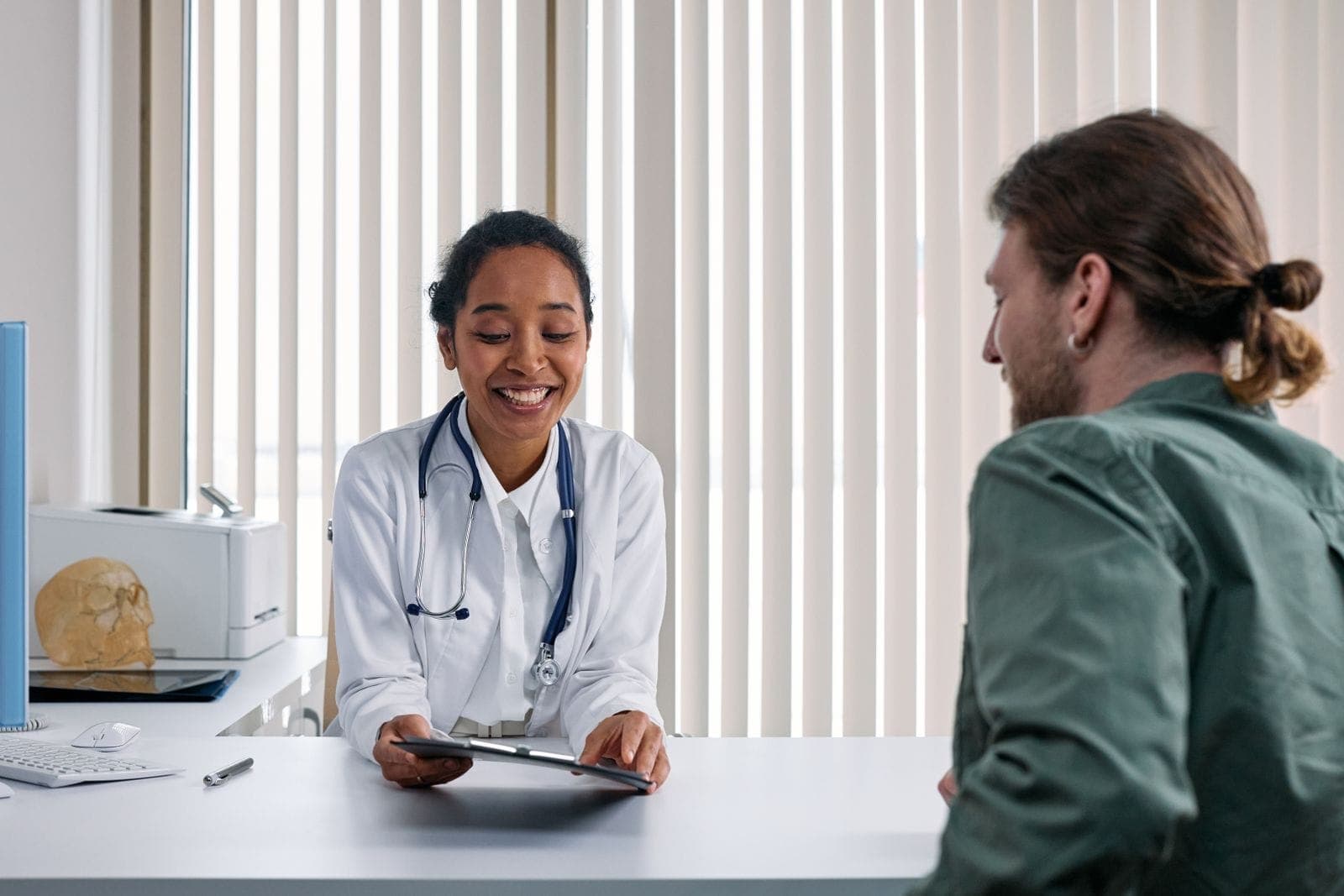 A healthcare professional offering guidance in a bright clinic